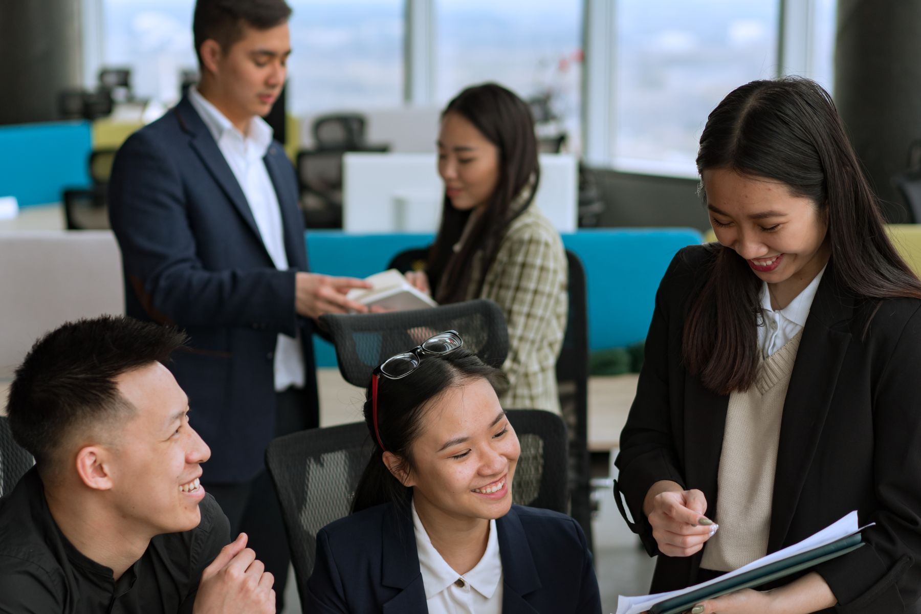 Young professionals talking together in an office